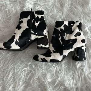 Black and white cow print fur boots, size 9